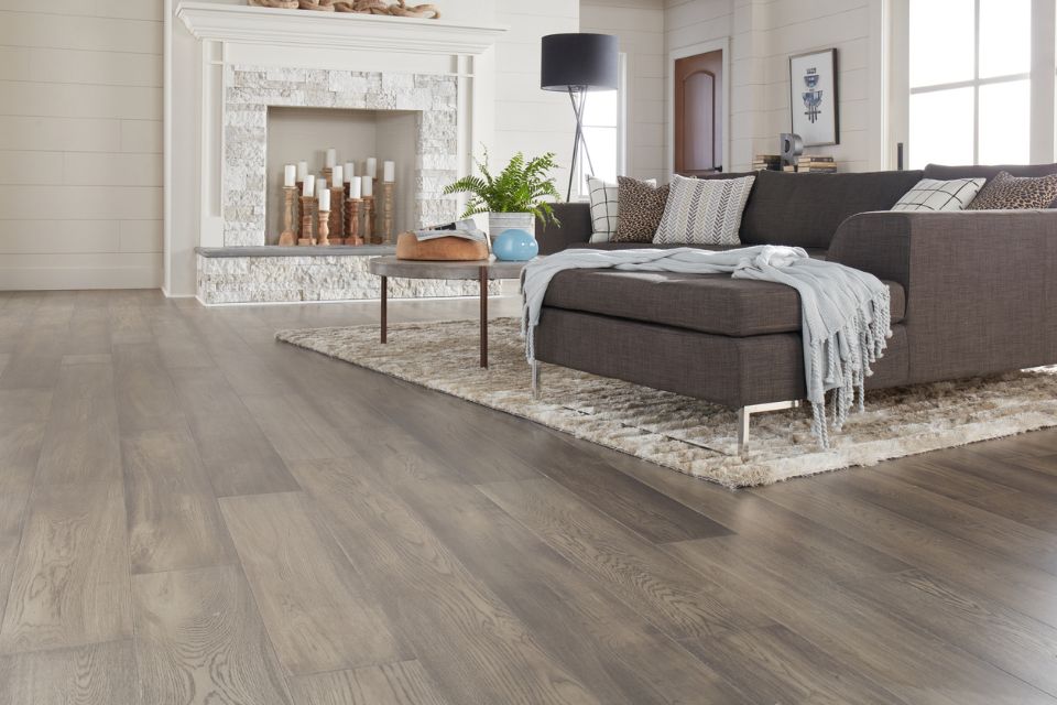 gray Invincible XT luxury vinyl plank in living room with area rug
